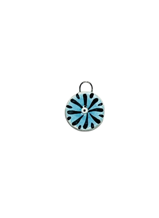 blue and black ceramic charm